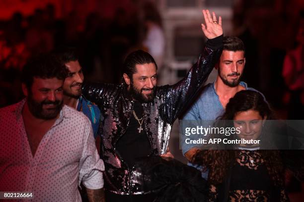 Spanish Flamenco's dancer Rafael Amargo waves to the audience after presentin his creations by Amoramargo, during the 080 Barcelona Fashion Week, at...