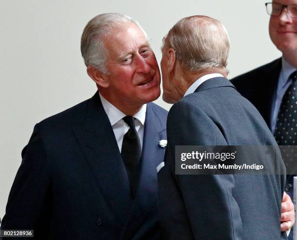 Prince Charles, Prince of Wales kisses his father Prince Philip, Duke of Edinburgh as they attend the funeral of Patricia Knatchbull, Countess...