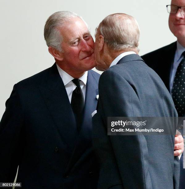 Prince Charles, Prince of Wales kisses his father Prince Philip, Duke of Edinburgh as they attend the funeral of Patricia Knatchbull, Countess...