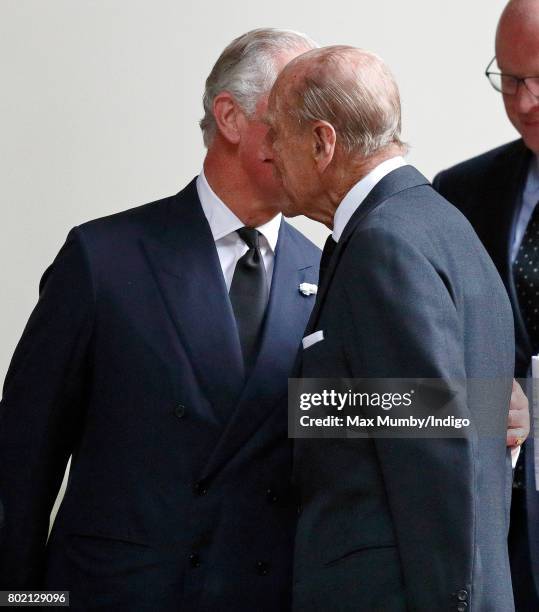 Prince Charles, Prince of Wales kisses his father Prince Philip, Duke of Edinburgh as they attend the funeral of Patricia Knatchbull, Countess...