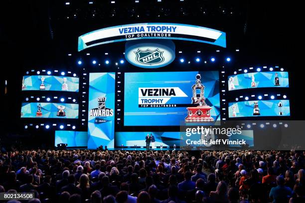 Former NHL players Bernie Parent and Kevin Weekes speak onstage to announce the recipient of the Vezina Trophy during the 2017 NHL Awards & Expansion...
