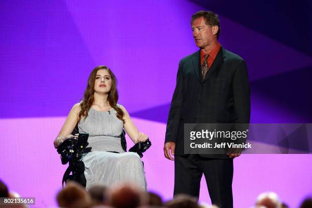 Denna Laing and former NHL player Bobby Carpenter speak onstage during the 2017 NHL Awards & Expansion Draft at T-Mobile Arena on June 21, 2017 in...