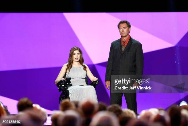 Denna Laing and former NHL player Bobby Carpenter speak onstage during the 2017 NHL Awards & Expansion Draft at T-Mobile Arena on June 21, 2017 in...