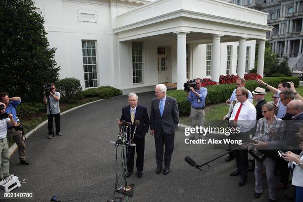 Senate Majority Leader Sen. Mitch McConnell and Senate Majority Whip Sen. John Cornyn speak to members of the media outside the West Wing of the...