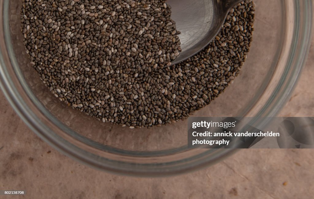 Chia seeds in a glass bowl.