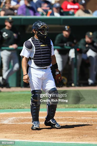 Ivan Rodriguez of the Detroit Tigers catches during the game against the Pittsburgh Pirates at the Joker Marchant Stadium in Lakeland, Florida on...