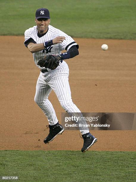 New York Yankees Derek Jeter fielding in a regular season game against the Boston Red Sox played at Yankee Stadium in Bronx, N.Y. Red Sox defeated...