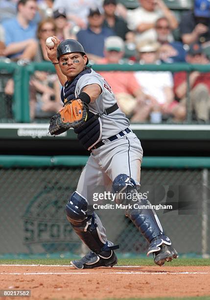 Ivan Rodriguez of the Detroit Tigers throws during the spring training game against the Atlanta Braves at Champion Stadium in Lake Buena Vista,...