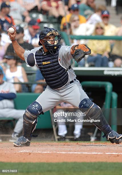 Ivan Rodriguez of the Detroit Tigers throws during the spring training game against the Atlanta Braves at Champion Stadium in Lake Buena Vista,...