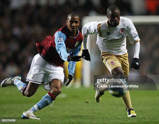 Ashley Young of Aston Villa battles with George Boateng of Middlesbrough during the Barclays Premier League match between Aston Villa and...