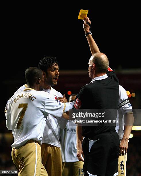 Mido of Middlesbrough is booked by Referee Steve Bennett over his penalty decision during the Barclays Premier League match between Aston Villa and...