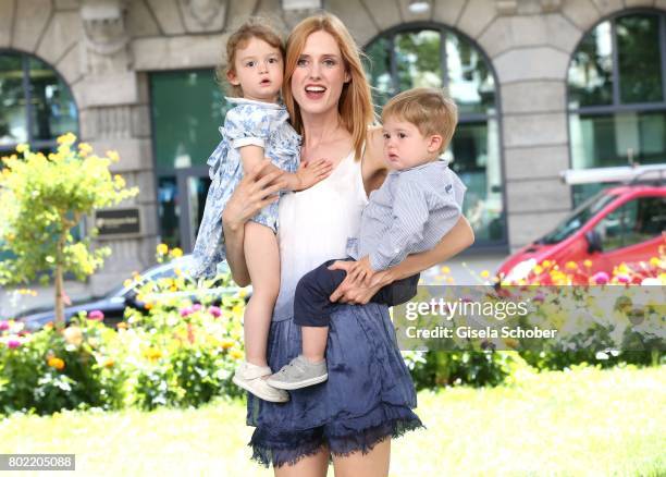 Wilma Elles poses with her twins, son Milat and daughter Melodi during a photo session on June 27, 2017 in Munich, Germany.