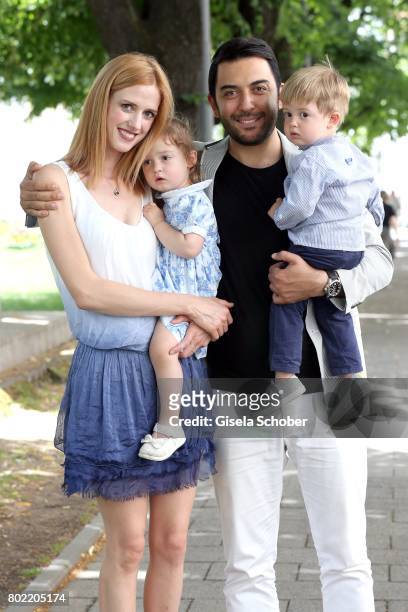 Wilma Elles poses with her husband Kerem Goegus and their twins, son Milat and daughter Melodi during a photo session on June 27, 2017 in Munich,...
