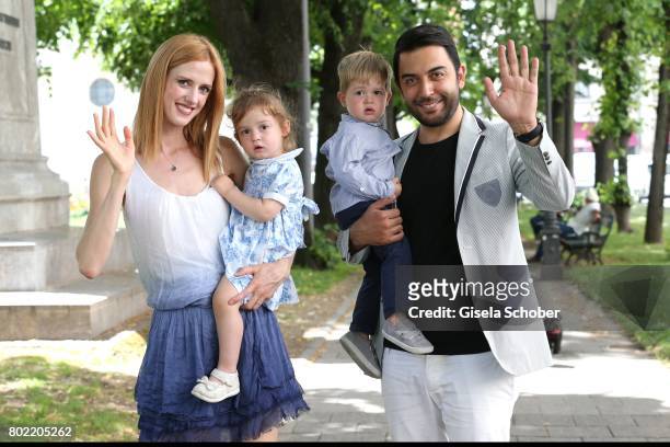 Wilma Elles poses with her husband Kerem Goegus and their twins, son Milat and daughter Melodi during a photo session on June 27, 2017 in Munich,...