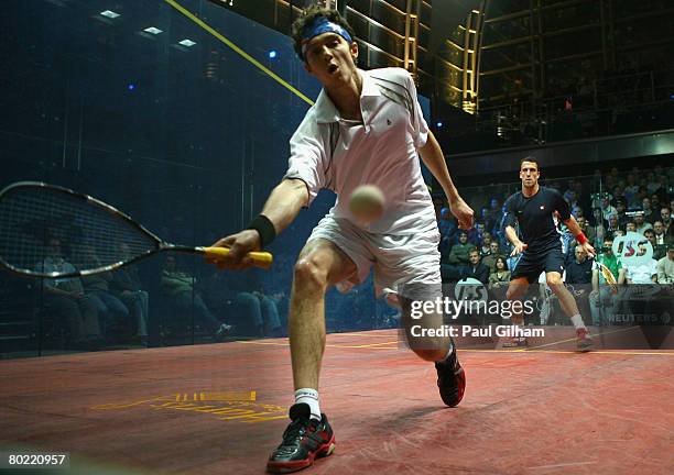 Cameron Pilley of Australia in action during the quarter final match against Peter Barker of England during the ISS Canary Wharf Squash Classic at...