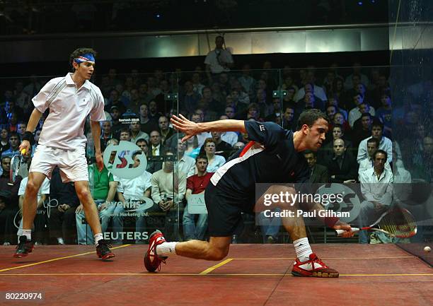 Peter Barker of England in action during the quarter final match against Cameron Pilley of Australia during the ISS Canary Wharf Squash Classic at...