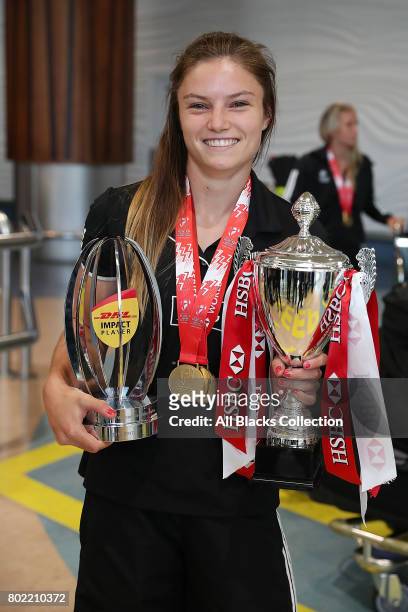 Michaela Blyde with the trophies including hers for Impact Player of the Season with the New Zealand Black Ferns as they arrive at Auckland...