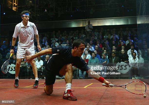 Peter Barker of England in action during the quarter final match against Cameron Pilley of Australia during the ISS Canary Wharf Squash Classic at...