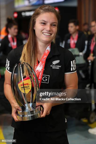 Michaela Blyde with the trophies including hers for Impact Player of the Season with the New Zealand Black Ferns as they arrive at Auckland...