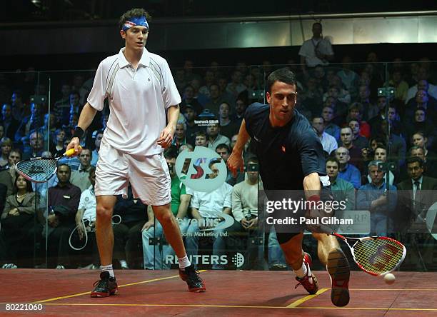 Peter Barker of England in action during the quarter final match against Cameron Pilley of Australia during the ISS Canary Wharf Squash Classic at...