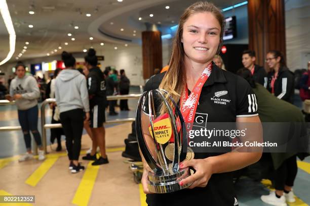 Michaela Blyde with the trophies including hers for Impact Player of the Season with the New Zealand Black Ferns as they arrive at Auckland...