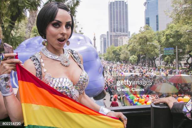 Actress Ivonne Montero poses with LGBTTI flag during a Gay Pride Parade on June 24, 2016 in Mexico City, Mexico.