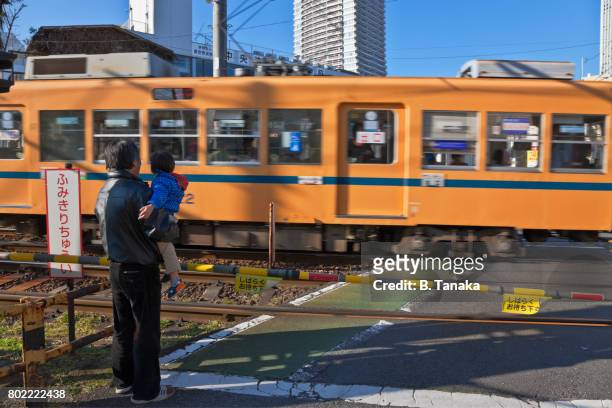 toden arakawa streetcar line in tokyo, japan - moving past ストックフォトと画像
