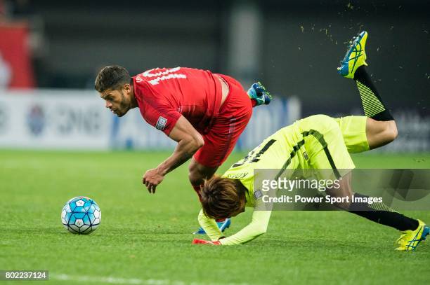Shanghai FC Forward Givanildo Vieira De Sousa fights for the ball with Urawa Reds Midfielder Komai Yoshiaki during the AFC Champions League 2017...