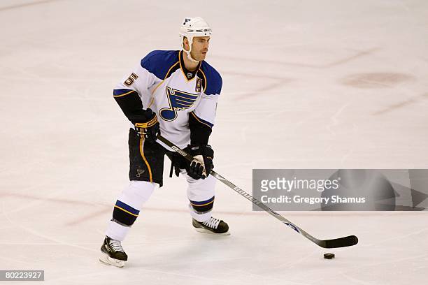 Barret Jackman of the St. Louis Blues skates with the puck against the Detroit Red Wings on March 5, 2008 at Joe Louis Arena in Detroit, Michigan.