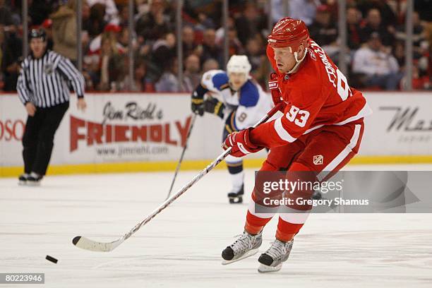 Johan Franzen of the Detroit Red Wings moves the puck against the St. Louis Blues on March 5, 2008 at Joe Louis Arena in Detroit, Michigan.