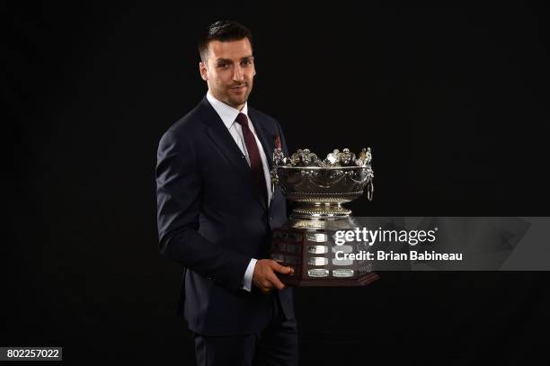Patrice Bergeron of the Boston Bruins poses for a portrait with the Frank J. Selke Trophy at the 2017 NHL Awards at T-Mobile Arena on June 21, 2017...