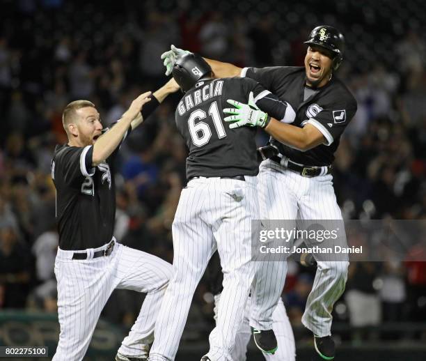 Jose Abreu of the Chicago White Sox celebrates his two run, game winning double in the 9th inning with Willy Garcia and Todd Frazier against the New...