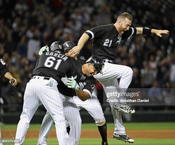 Jose Abreu of the Chicago White Sox celebrates his two run, game winning double in the 9th inning with Willy Garcia and Todd Frazier against the New...