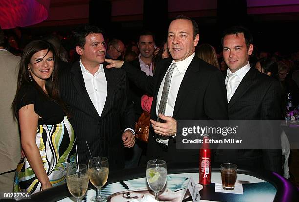 Angelique De Luca, producer Michael De Luca, actor Kevin Spacey, and producer Dana Brunetti pose during the "21" premiere after party held at the...