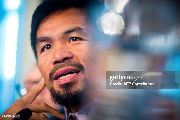 Philippine boxer Manny Pacquiao speaks during a press conference to promote his upcoming WBO welterweight boxing title fight against Australian...