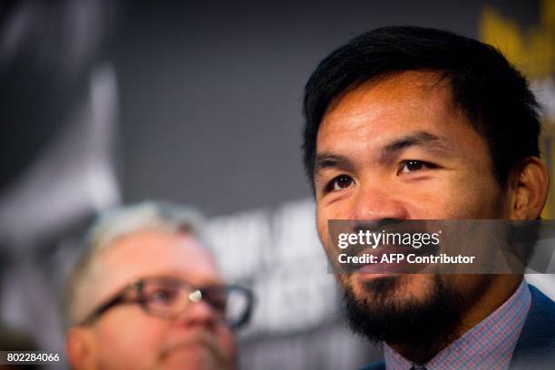 Philippine boxer Manny Pacquiao and trainer Freddie Roach attend a press conference to promote Pacquiao's WBO Welterweight title fight against...