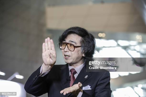 Yoshiyuki Sankai, founder and president of Cyberdyne Inc., speaks during a Bloomberg Television interview on the sidelines of the World Economic...