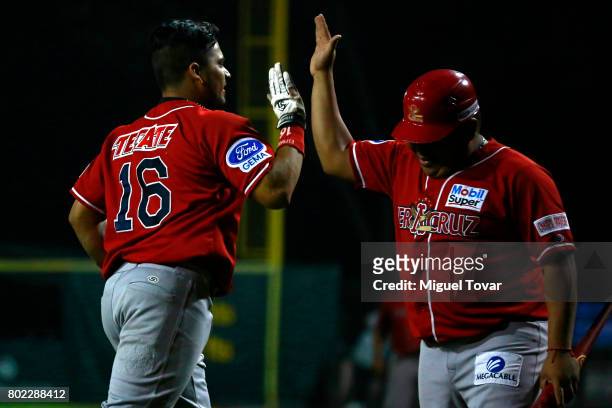 Alejandro Flores of Aguilas reacts after scoring during the match between Rojos del Aguila and Diablos Rojos as part of the Liga Mexicana de Beisbol...