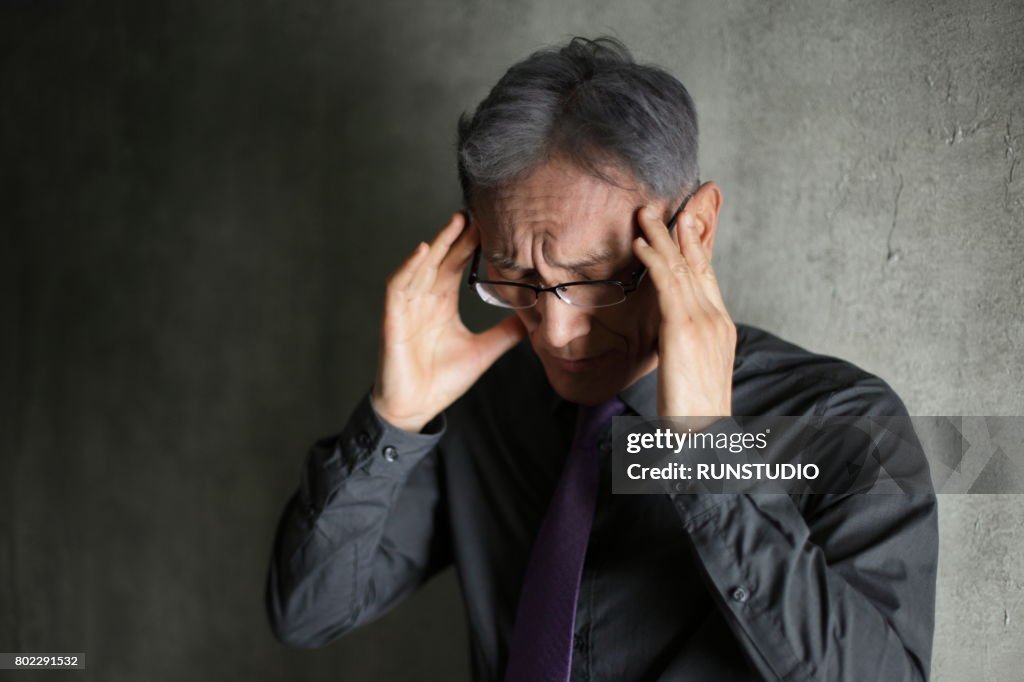 Middle-aged man with headache