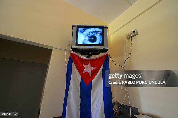 An eye surgery is seen on a screen at the doctor's room of the Hospital de Ojos in Montevideo on March 11, 2008. The Hospital de Ojos was created in...