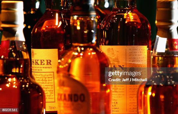 An assortment of bottled whisky is displayed at Glenkinchie distillery March 13, 2008 in Edinburgh, Scotland. Chancellor Alistair Darling has...