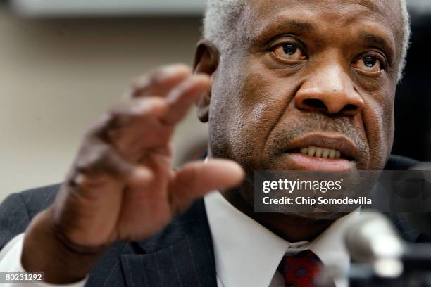 Supreme Court Justice Clarence Thomas testifies before the House Financial Services and General Government Subcommittee on Capitol Hill March 13,...