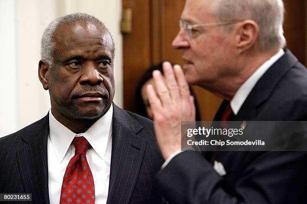 Supreme Court Justices Clarence Thomas and Anthony Kennedy prepare to testify before the House Financial Services and General Government Subcommittee...