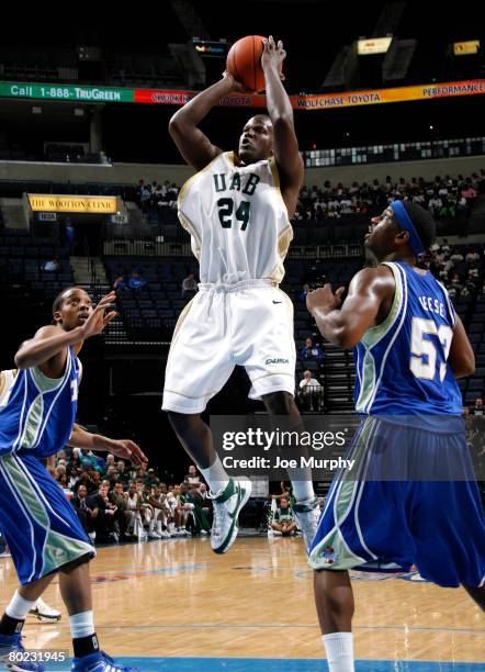 Robert Vaden of the UAB Blazers shoots a jumpshot past Ray Reese of the Tulsa Golden Hurricane during the quarterfinals of the Conference USA...