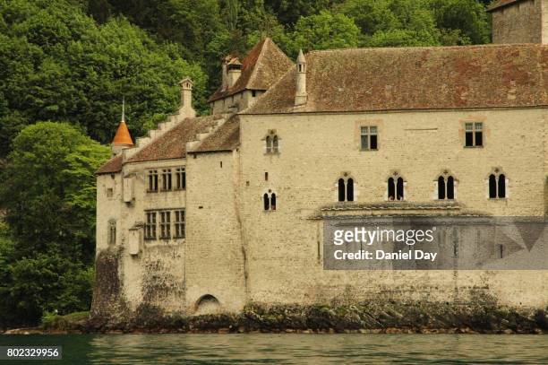 chateau de chillon is an island castle on lake geneva, switzerland - chillon foto e immagini stock