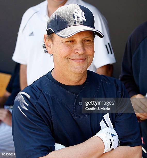 Billy Crystal of the New York Yankees walks the dugout prior to the Grapefruit League Spring Training game against the Pittsburgh Pirates during on...