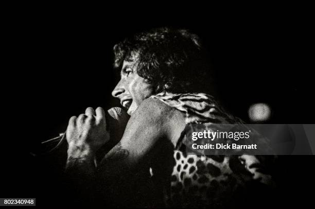 Bon Scott of AC/DC performing on stage, Lyceum Theatre, London, United Kingdom on July 7, 1976 from the Lock Up Your Daughters Tour.