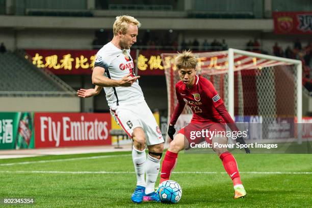 Sydney Wanderers Midfielder Mitch Nichols in action against Shanghai FC Defender Fu Huan during the AFC Champions League 2017 Group F match between...