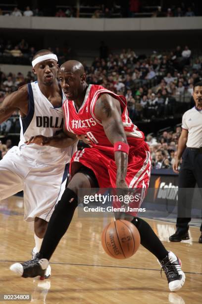 Bobby Jackson of the Houston Rockets moves the ball up court against Jason Terry of the Dallas Mavericks during the game at American Airlines Center...