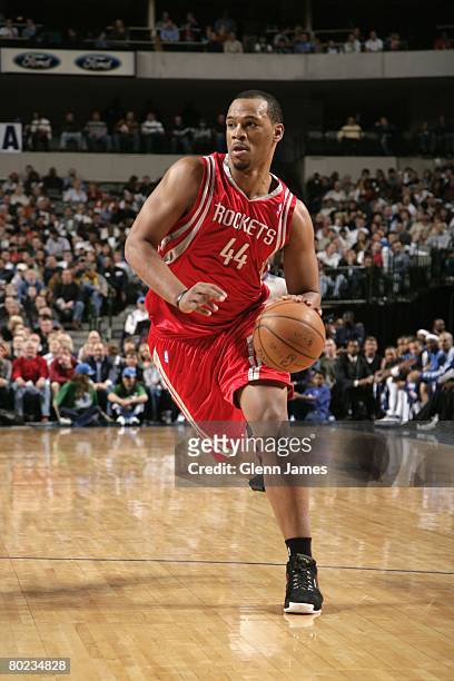 Chuck Hayes of the Houston Rockets moves the ball up court during the game against the Dallas Mavericks at American Airlines Center on March 6, 2006...